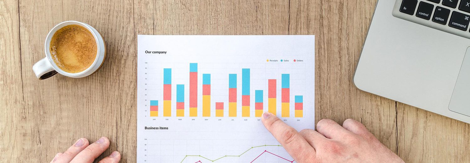 Graph data on a sheet of paper on a wooden desk