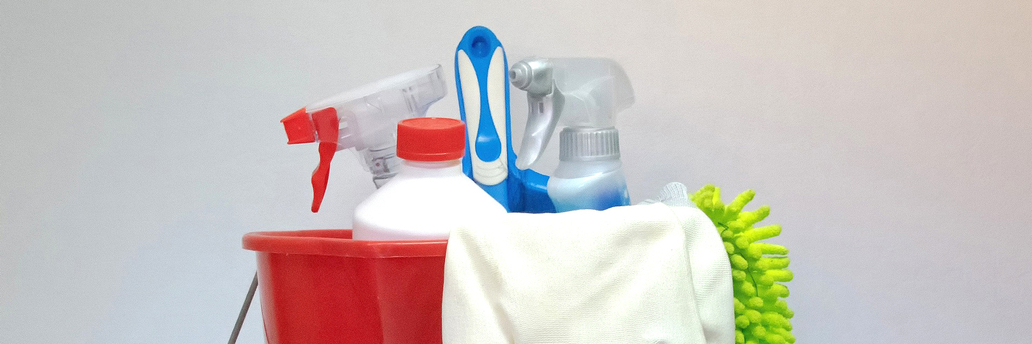 red bucket with cleaning supplies inside