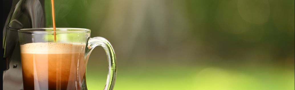 Steaming hot coffee brewing from a keurig