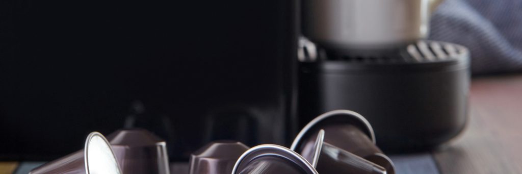 keurig coffee maker behind coffee pods