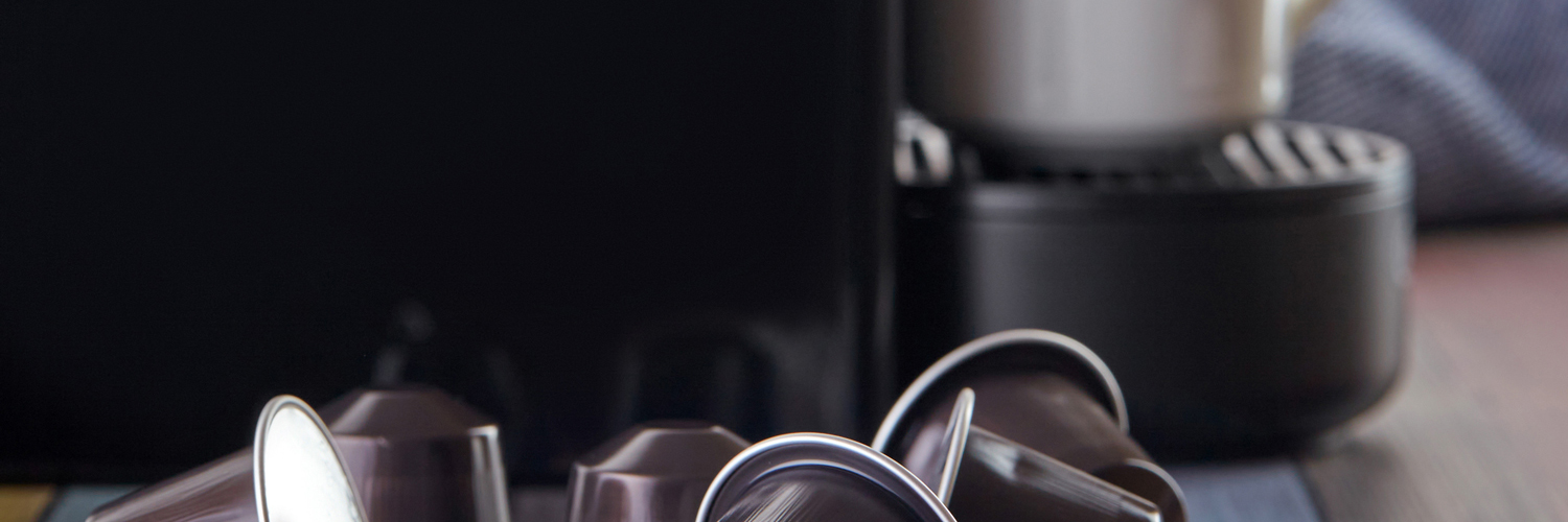 keurig coffee maker behind coffee pods