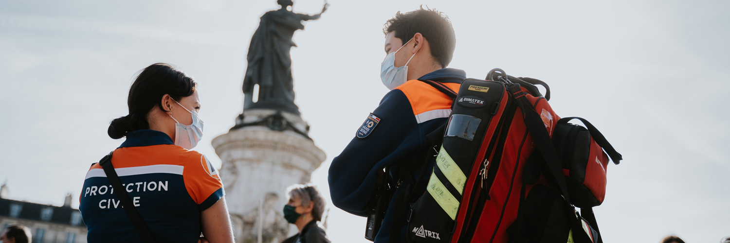 male and female first responders at the scene of an emergency
