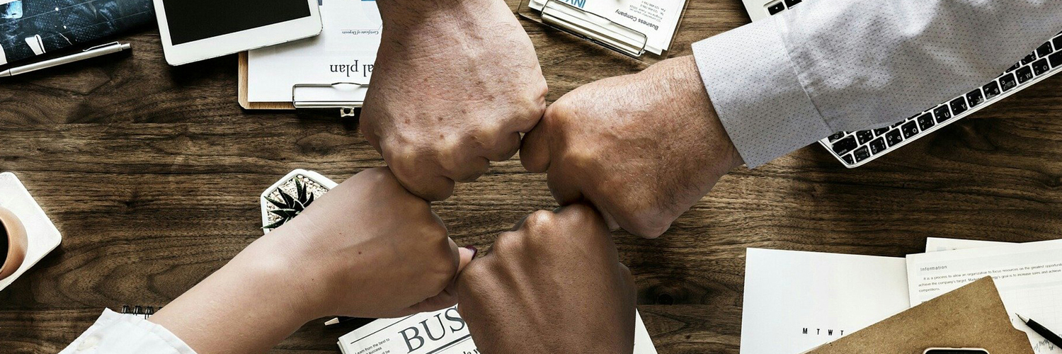 fist bumps demonstrating teamwork