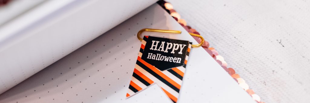 halloween decoration clipped to paper in the office