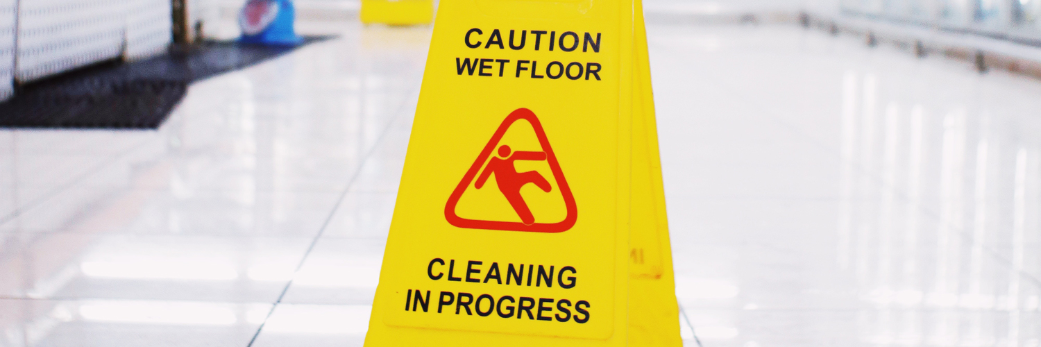 yellow caution wet floor sign in store