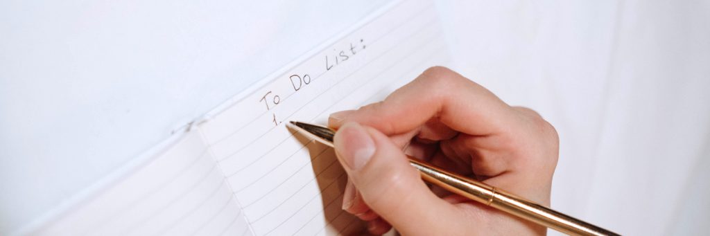 someone writing the start of their to do list
