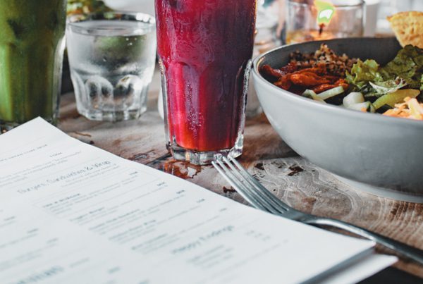 food and drinks on table with menu