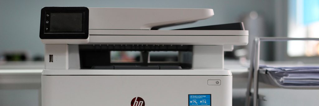 hp printer sitting on table in office
