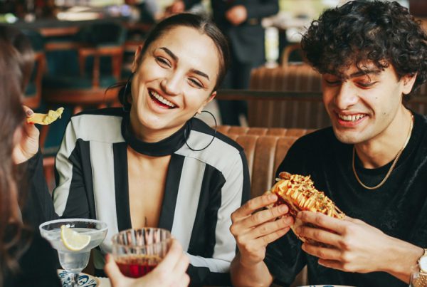 three people eating at restaurant