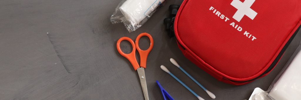 red bag surrounded by medical supplies