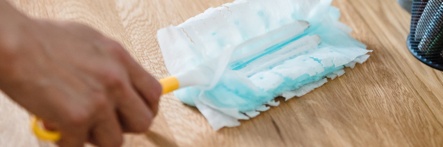 dusting the table at the office