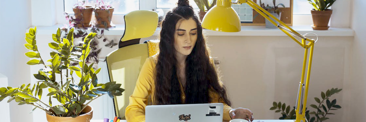 woman working from office with plants
