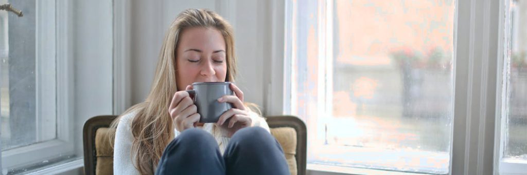 Girl drinking tea to warm up