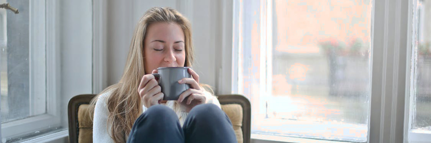 Girl drinking tea to warm up