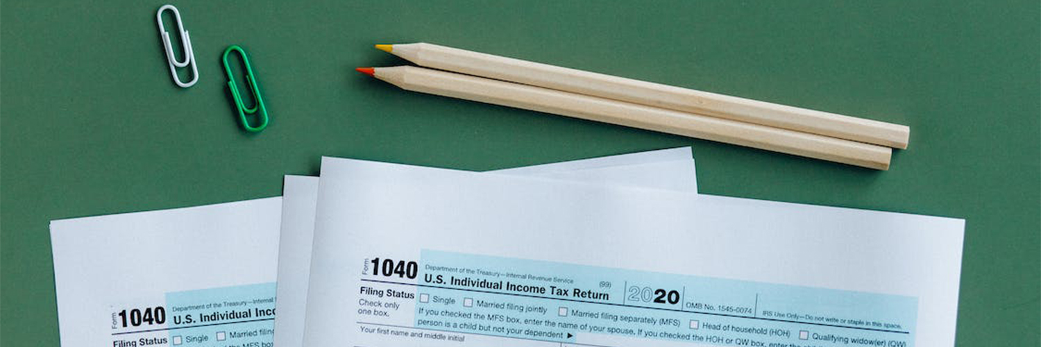 Tax documents on the table with pencils