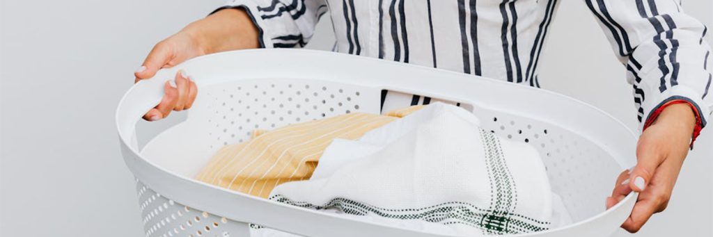 woman carrying laundry basket