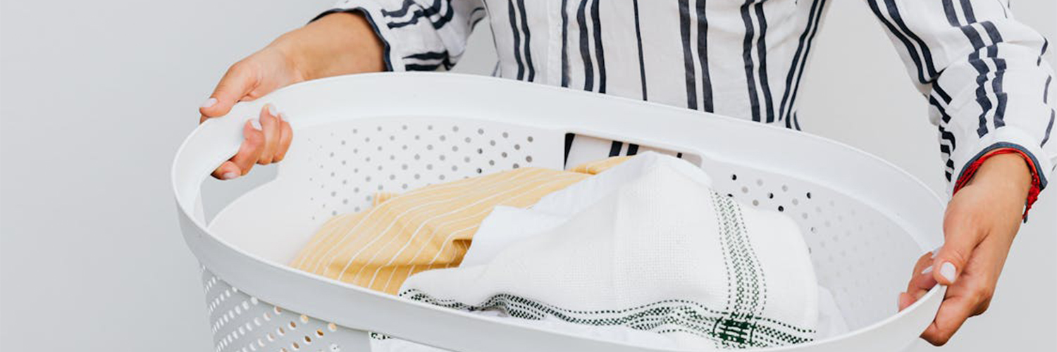 woman carrying laundry basket