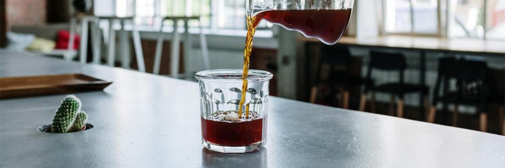 someone pouring coffee from above