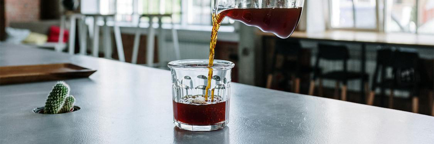 someone pouring coffee from above