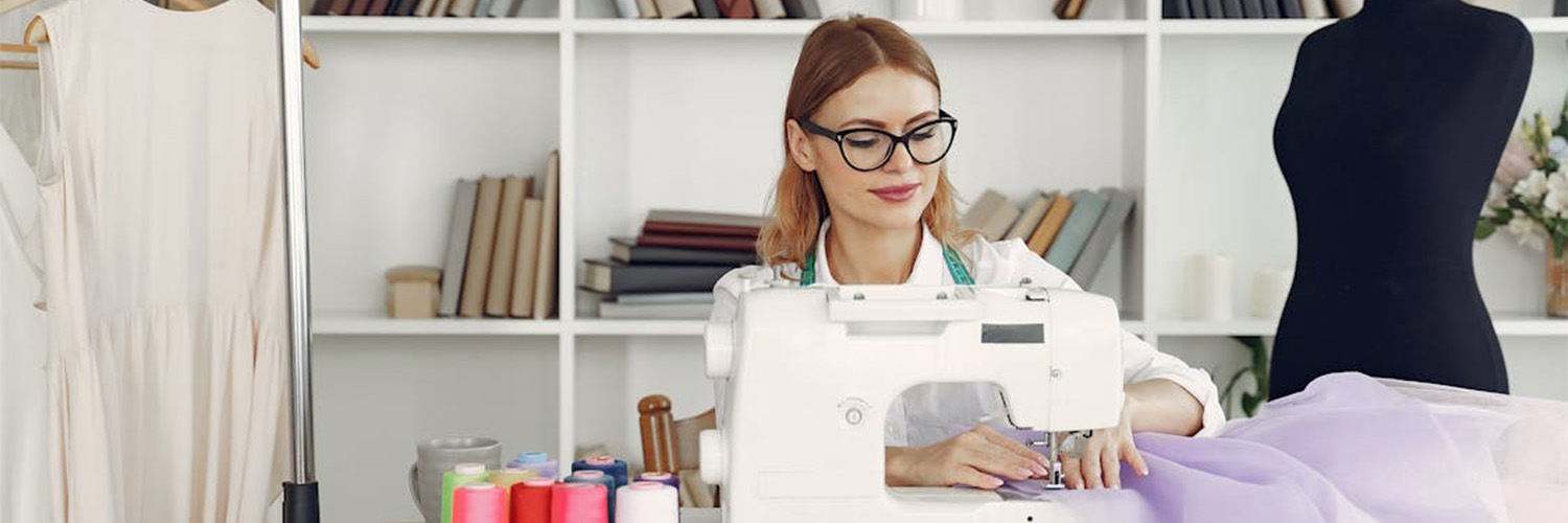 woman sewing fabric at desk