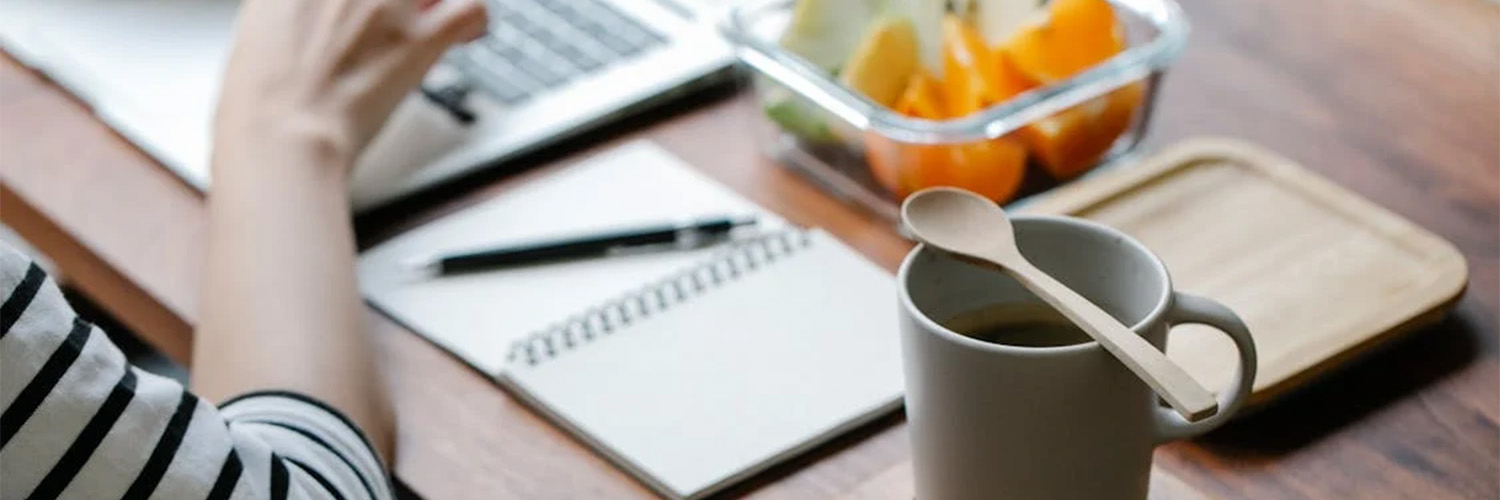apples and tea on desk